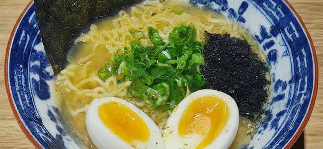 Shio Ramen in bowl with half egg.