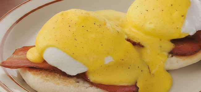 Plate with two eggs benedict.