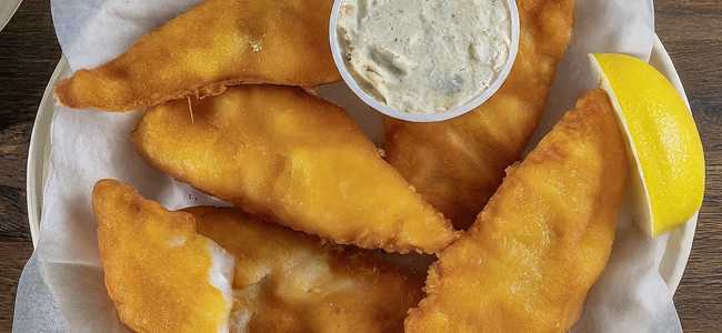 Fried battered fish on a plate.